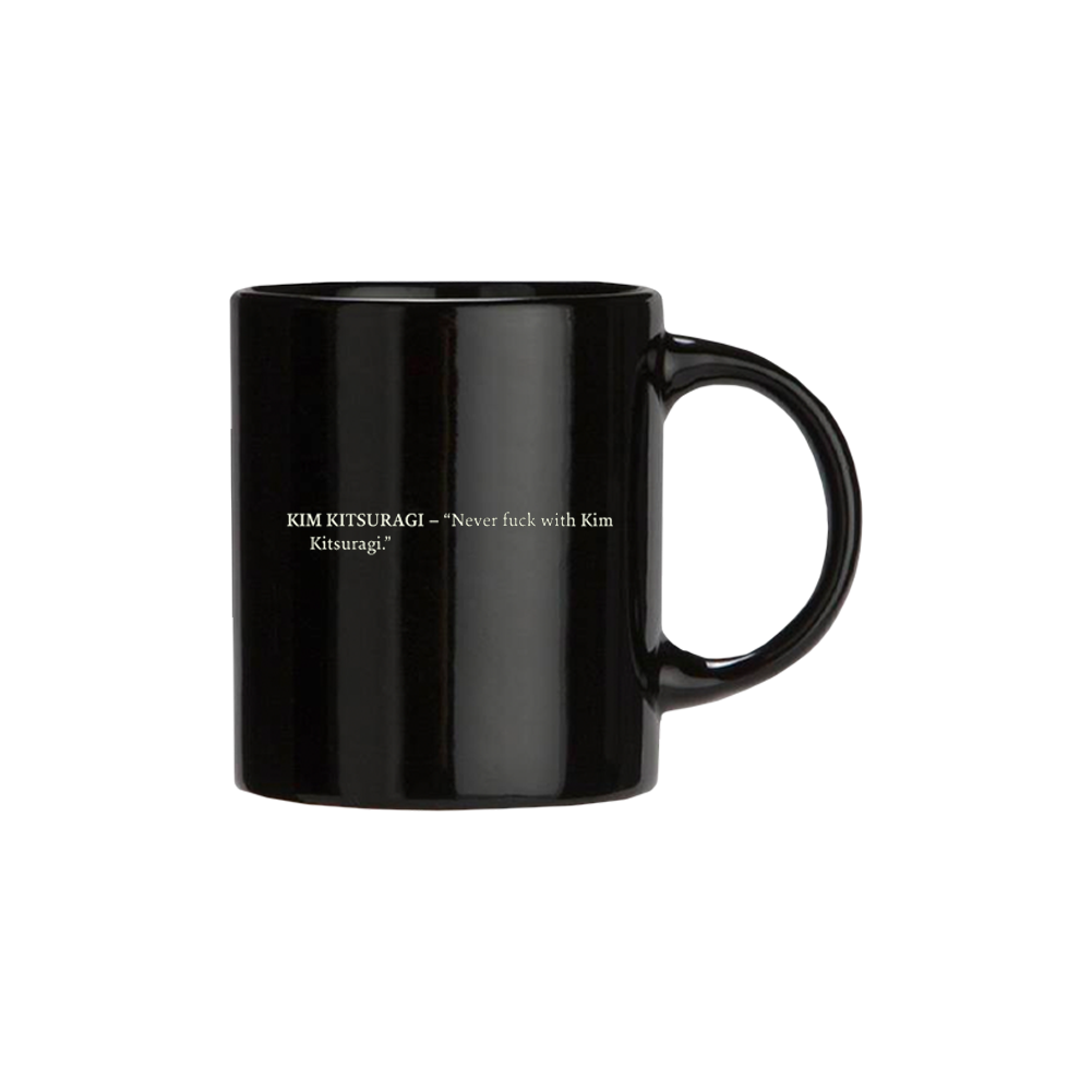 Black ceramic mug with white text printed on its side.